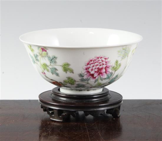 A Chinese famille rose bowl, diameter 10.8cm, wood stand